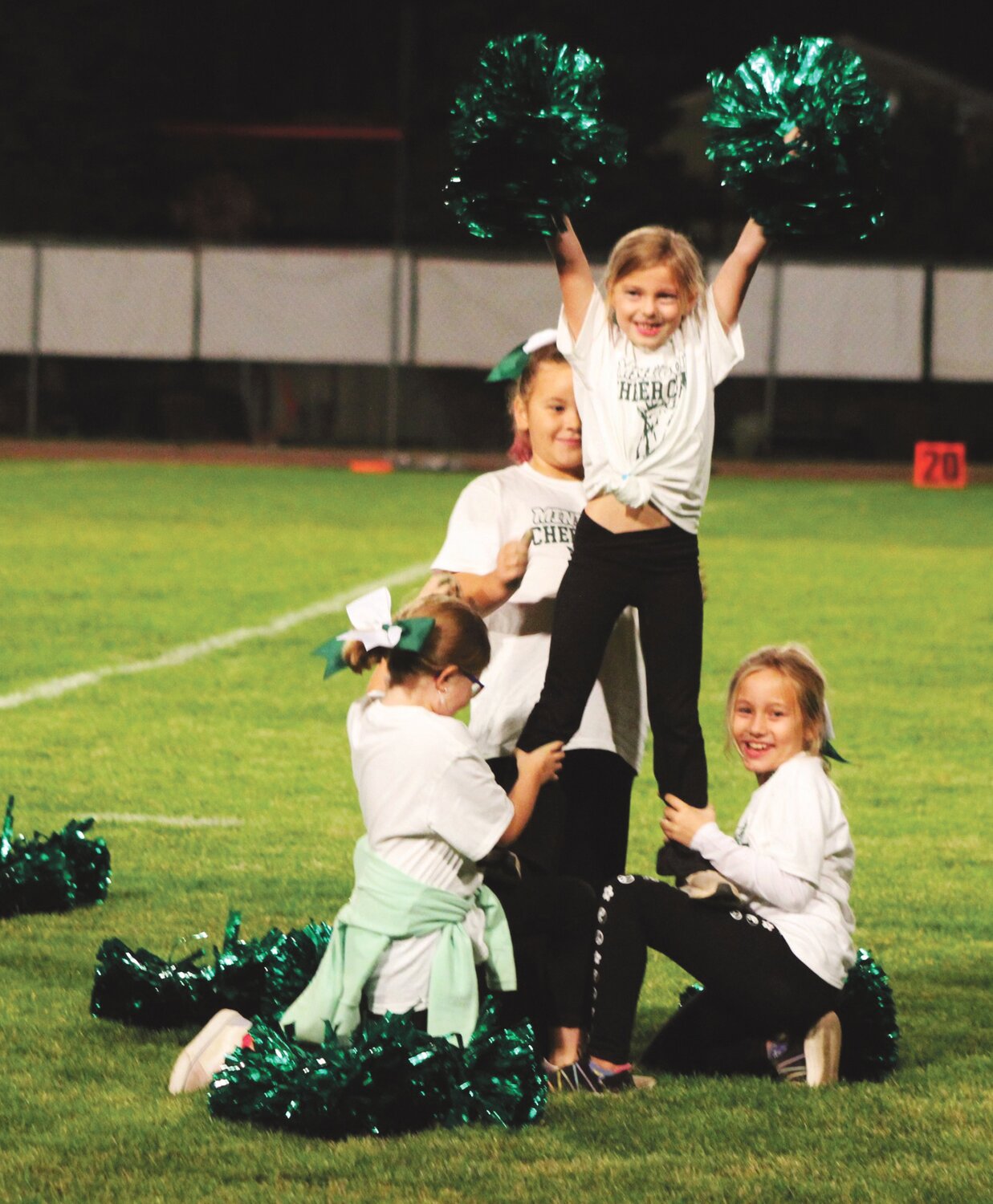 Scores of Mini Goats cheerleaders performed at halftime.
MIKE MALTAIS/WARD MEDIA