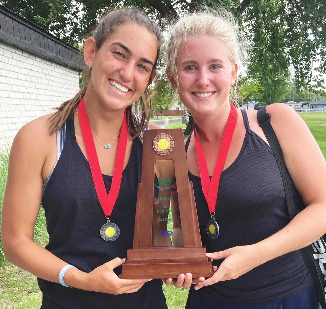 Second place junior Maya Cowan (left) and senior Piper Grossberg (right) along with the third place team trophy.
Courtesy Chelan High School Tennis