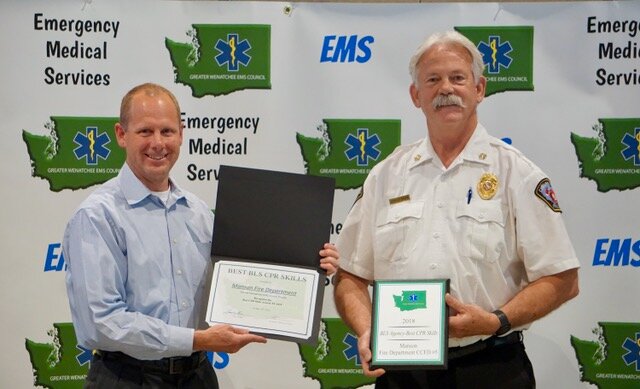 Manson Fire Department (CCFD#5) received the Best BLS Cardiopulmonary Resuscitation Skills of the Year Award having outperformed all other EMS agencies in Chelan/Douglas Counties during the High-Performance CPR skills testing completed by  the GW EMS Council’s Quality Improvement Officer for both team and individual performance. Dr. Lance Jobe, EMS Medical Director for Chelan/Douglas Counties presented the award to Manson Fire Chief Arnold Baker (right).