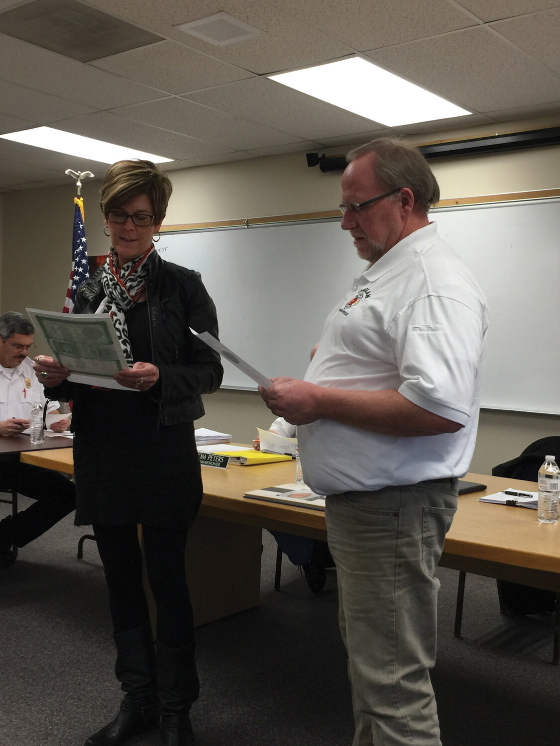 CFR 7 Administrative Office Manager Carol Kibler guides Phil Moller through the Oath of Office speech necessary to solidify his position as commissioner.