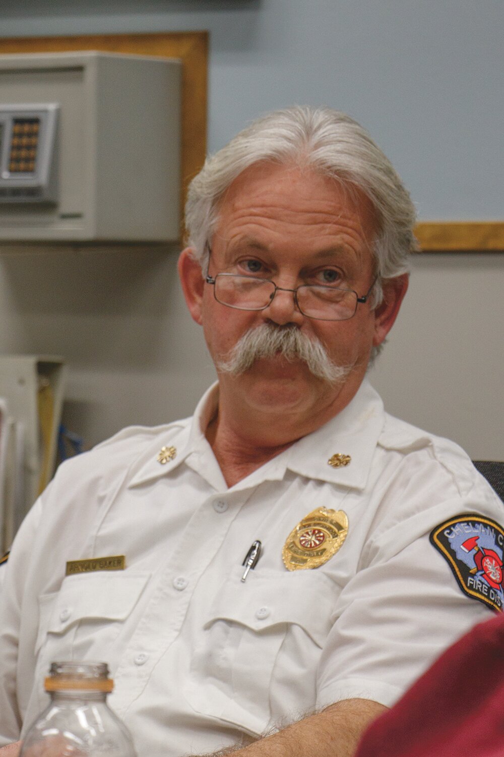 Manson Fire Chief Arnold Baker discusses dispatch times with commissioners at the regular meeting, Tuesday, Jan. 9 at the Fire Station.