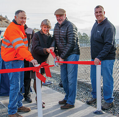Cutting the ribbon and officially opening the roundabout were (left to right) Jim Gehbardt of Strider Construction, Former Senator Linda Evans Parlette, Chelan Mayor Mike Cooney, and Project Engineer Kevin Waligorski