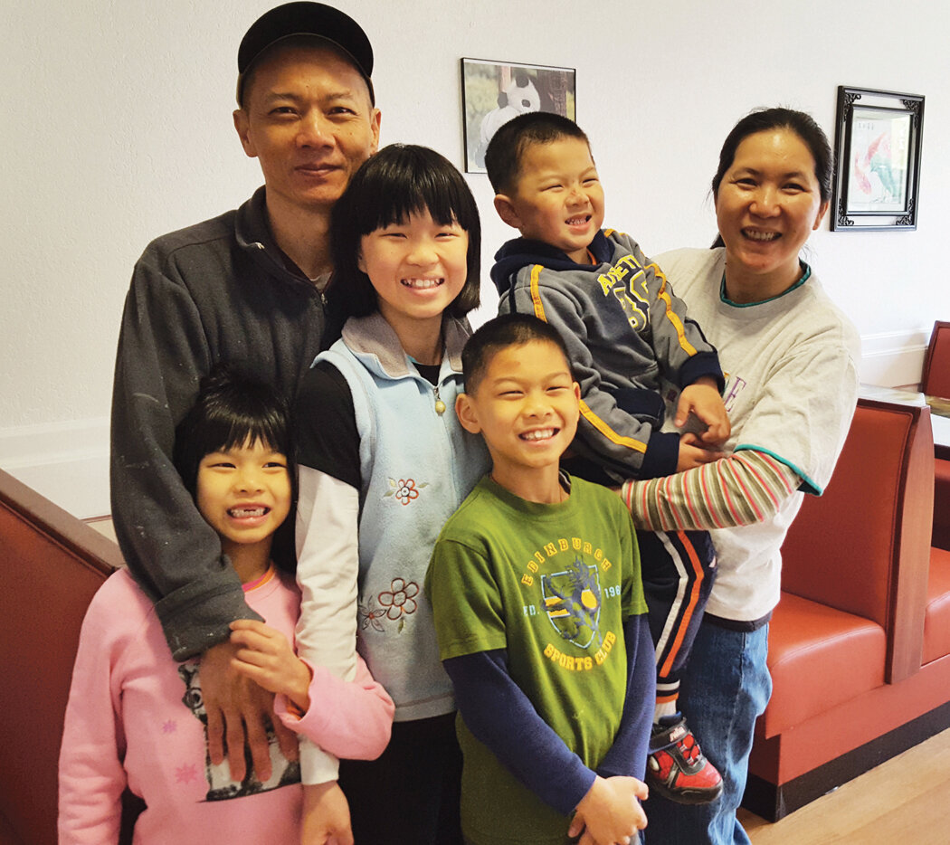 The news owners of the Panda Chinese Restaurant pose with their children: left to right are: Anna, Fu Zhong, Jennifer, David, Calvin and Qun Luo.