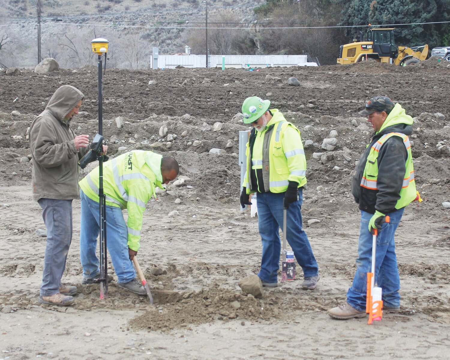 A crew from Hurst Construction, contractors for the Douglas County PUD’s Conklin Landing RV Park, take measurements at one of the 17 parking pads that will border the north and west sides of the development.
