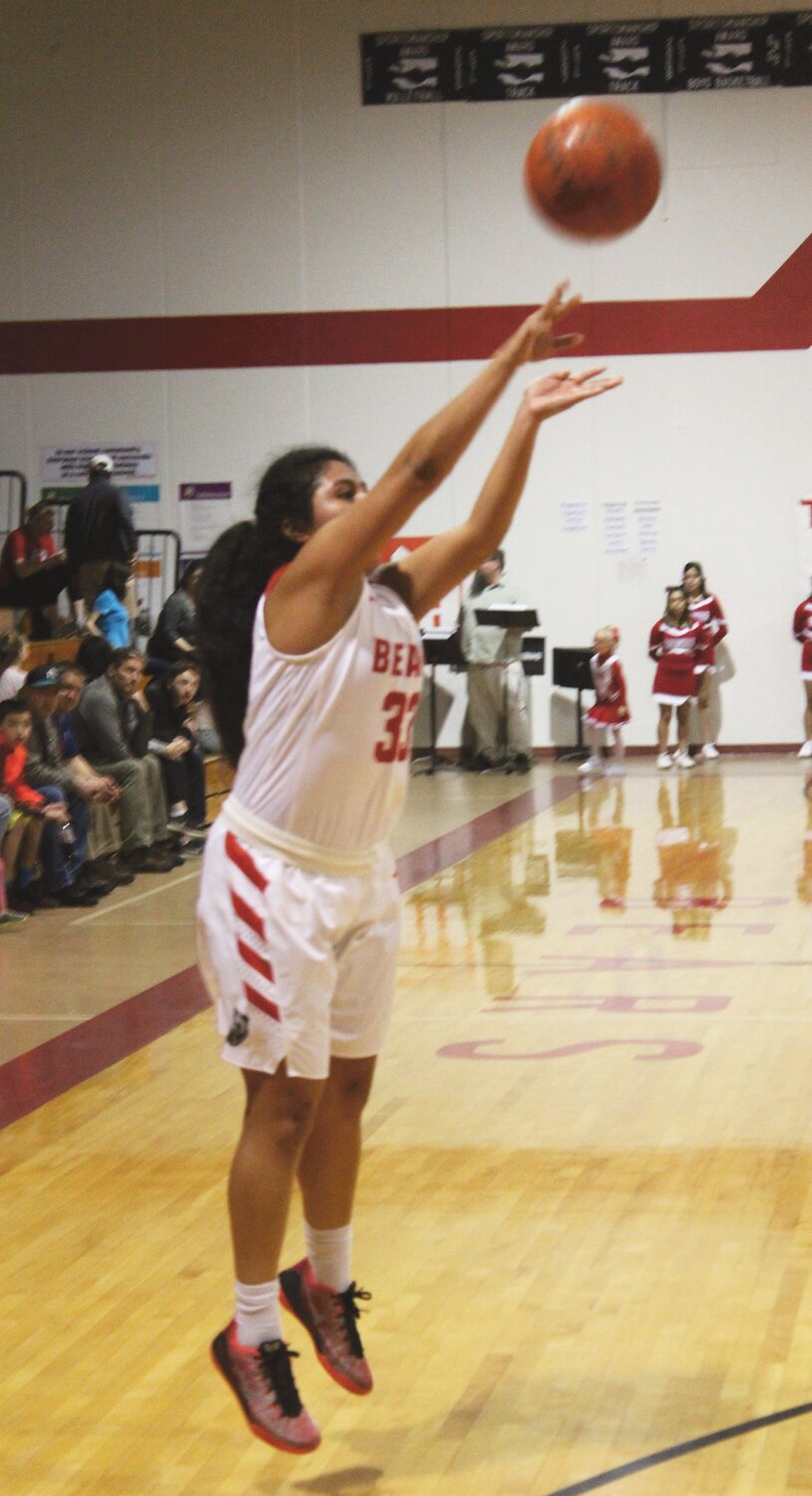 Yvette Sanchez, shown here shooting a three-pointer during a regular season game, led the Lady Bears against the Raiders with 12 points.
