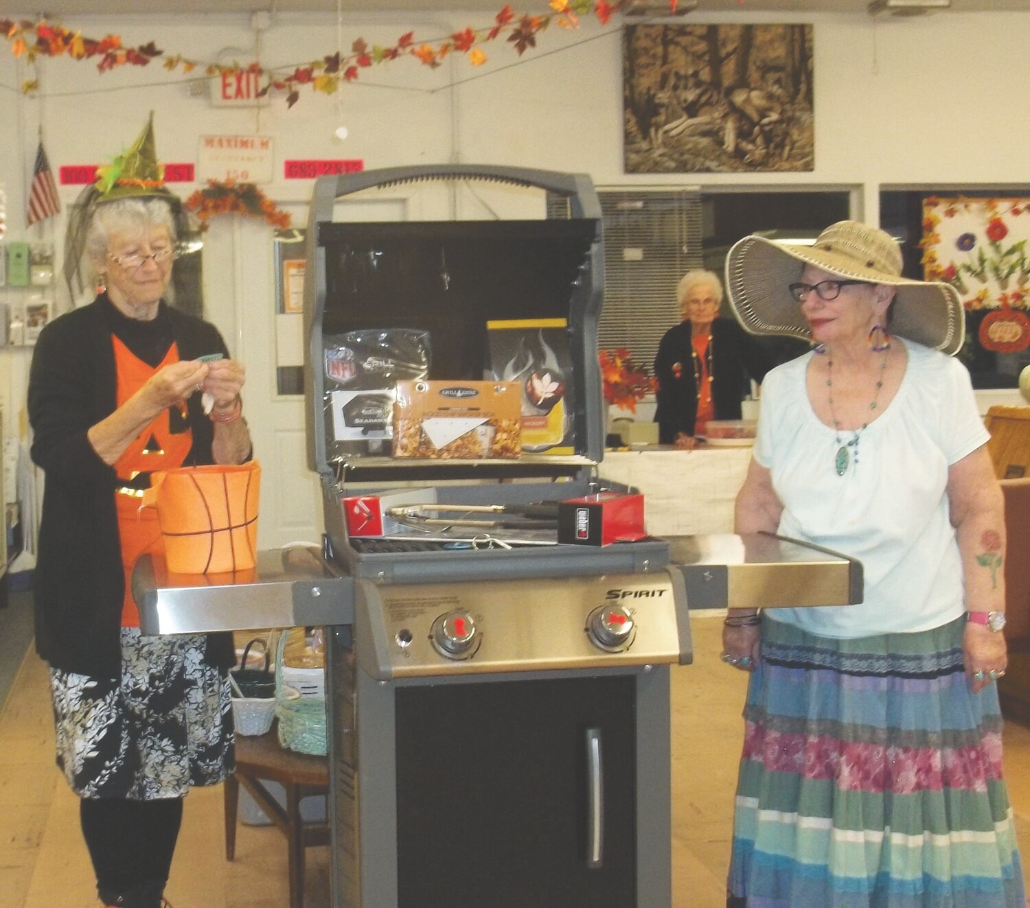 Patsy Whitley, left, and Sue Burgess drew the winning name in the barbecue grill raffle.