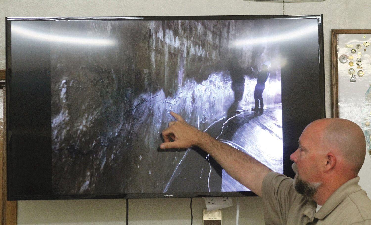 Photo By Mike Maltais
Brewster public works director, Lee Webster points to some interior damage found during a recent inspection of the city’s old water tank.