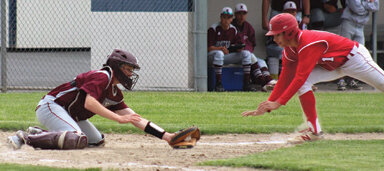 Freshman, Kade Kelpman is greeted by the Coyotes’ catcher with ball in glove as he tries to score against Kittitas.