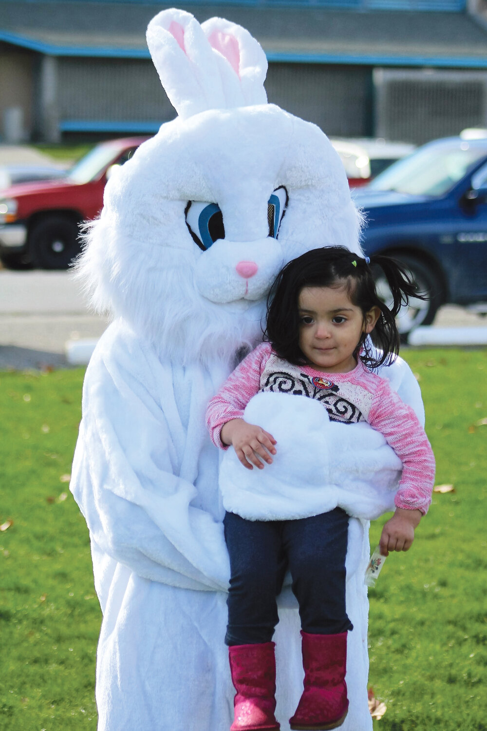 The Easter Bunny grabbed a prize of his own in two-year-old Miriam Garcia at the BBGC Egg Hunt.