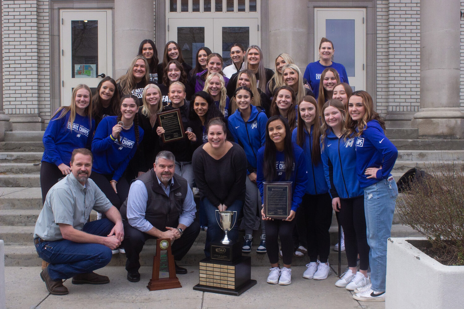 Manson Trojans and Wenatchee Panthers pose with Chelan County Commissioners at the proclamation of Dec. 15 as Volleyball State Champions Day in Chelan County.