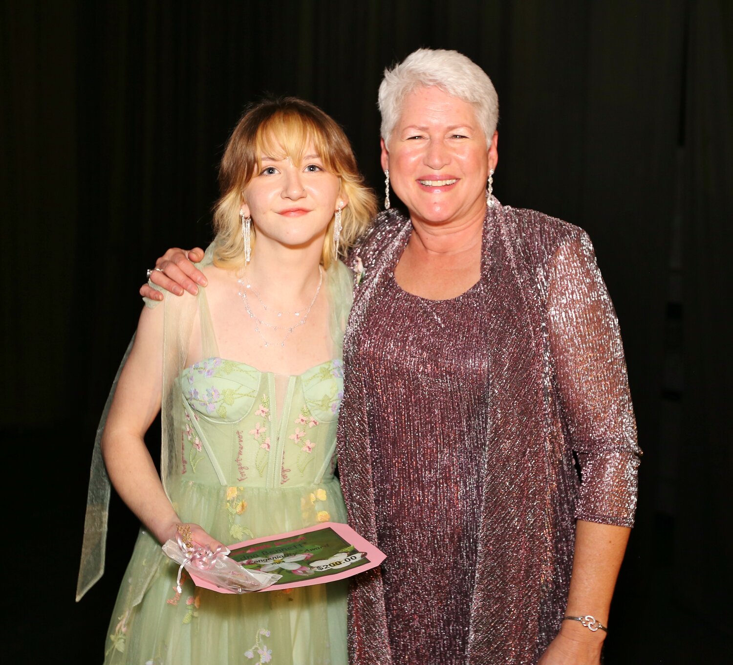 Queen Isabelle Harris was awarded the Edna Bennett Congeniality Scholarship. She is pictured with Susie Fox great-granddaughter of Edna Bennett.