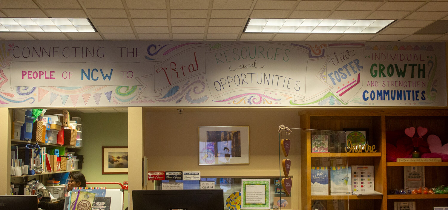 Massey’s final project before retiring was the installation of the NCW Libraries mission statement above the help desk.