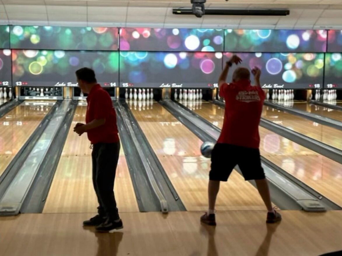 Trenton Hudkins and Michael Hilde compete in bowling with the Chelan Special Olympics.