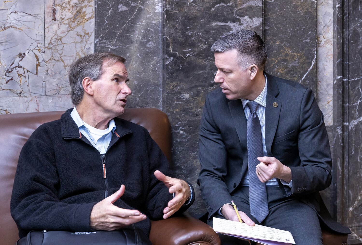 Leavenworth Mayor Carl Florea (left) visits with Sen. Brad Hawkins in Olympia to discuss affordable housing, tourism issues, and capital budget requests.