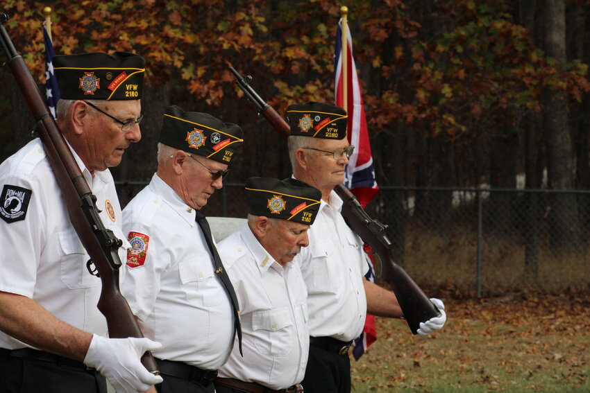 Members of the color guard march away after posting the colors.