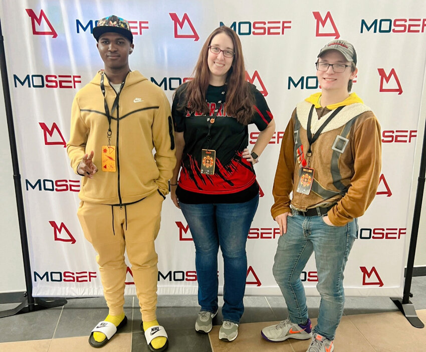 Tim Washington, left, is pictured with Warrenton High School esports sponsor Elizabeth Hancock and teammate Brett Dillion after the conclusion of the state championship.