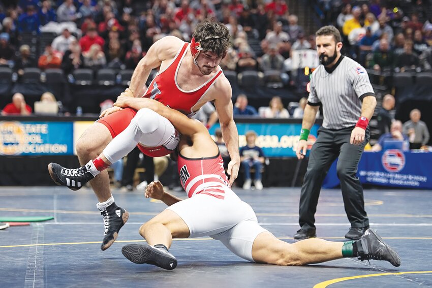 Warrenton’s Jacob Ruff, above, wrestles Van Horn’s CJ Nelson in the Class 3 third-place match at 215 pounds Saturday at Mizzou Arena in Columbia. Ruff beat Nelson 4-3 to earn a state medal for the second consecutive year.