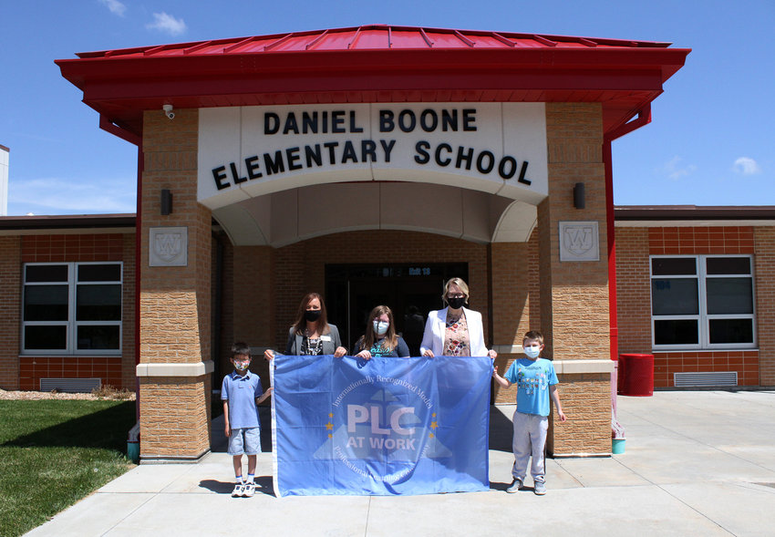 PLC RECOGNITION &mdash; Daniel Boone Elementary has once again been recognized as a Professional Learning Community, after earning the distinction in 2018. The school met the criteria and data requirements to place it among just 25 chosen elementaries in Missouri. Pictured are, from left, Kyle Vo, Principal Dr. Stacie Goldsmith, Maitreya Wells, Assistant Principal Jodi Brown and Bradly Kelly.      Derrick Forsythe photo.