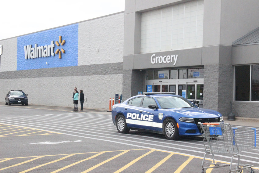 Police officers were called to search Walmart in Warrenton after the store was evacuated for a bomb threat.    Adam Rollins photo.