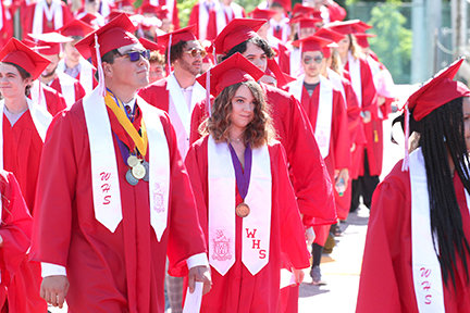 Class of 2021 Warrenton High School students parade into their graduation ceremony in this 2021 file photo.