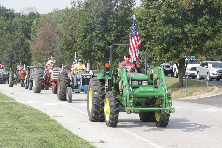 TRACTOR CRUISE &mdash; Tractors begin their cruise through southern Warren County on a mission to collect food and money for area food pantries during the Journey For Charity Tractor Cruise on Sept. 12.