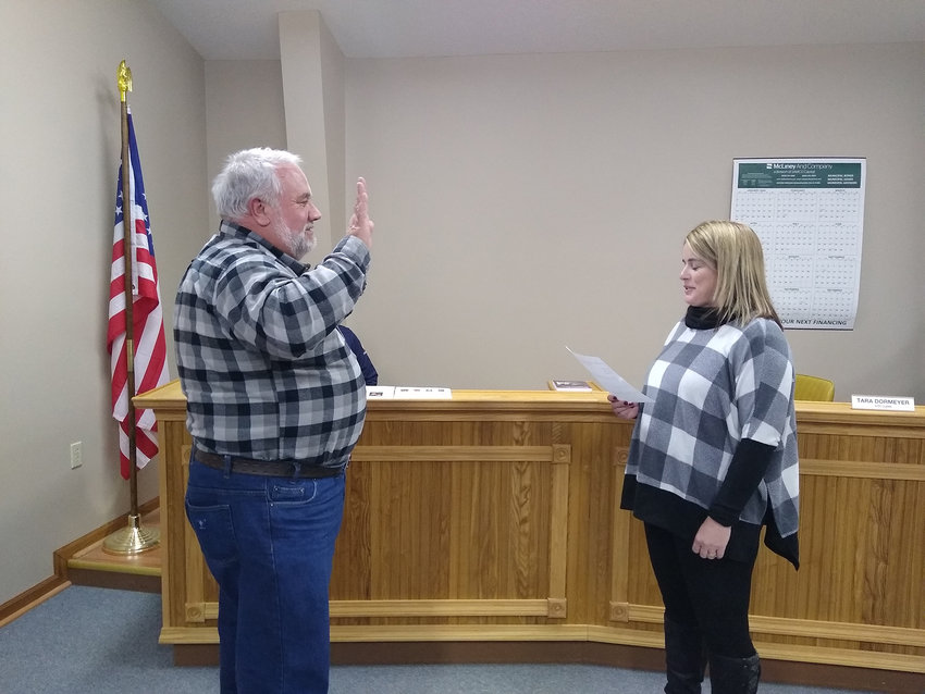 NEW ALDERMAN &mdash; Newly appointed Marthasville Alderman Gary Dixon swears his oath of office at the beginning of a Jan. 26 board of aldermen meeting. Dixon replaces predecessor Dan Grafrath and is running unopposed for election in April. Administering the oath is City Clerk Tara Dormeyer.