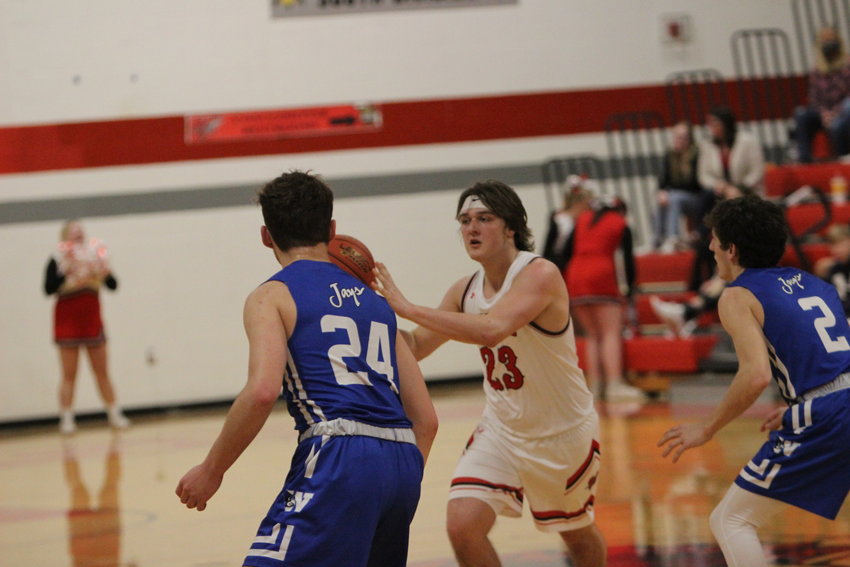 Warrenton High School guard Joe Goldsmith passes the ball during the first half of Tuesday&rsquo;s home game against Washington High School. Goldsmith led the Warriors with 28 points.