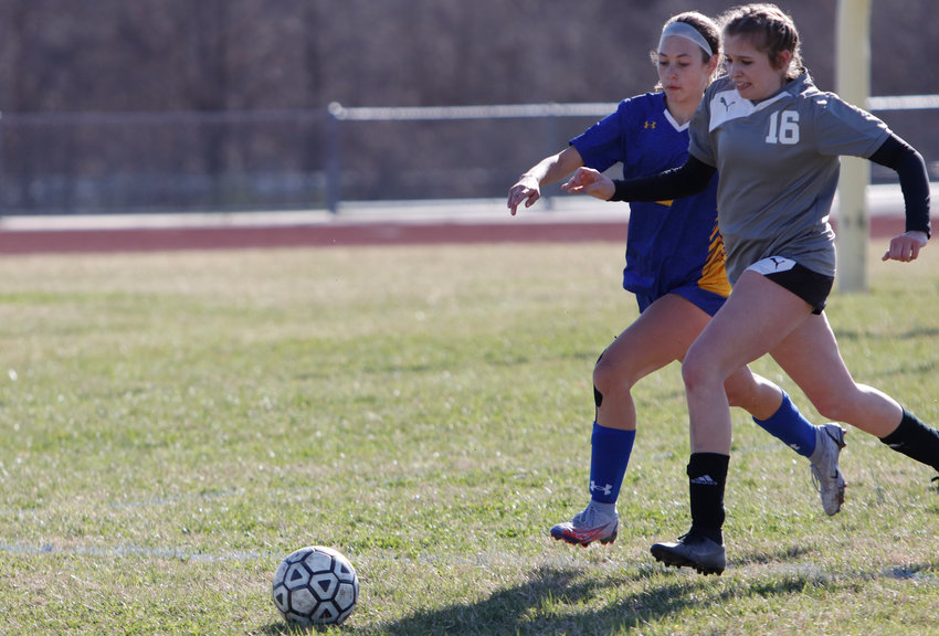 Wright City soccer player Paige Kirn (left) and Liberty Christian soccer player Lauren Moss (right) battle for possession of the ball during the first half of Friday's game. Wright City defeated Liberty Christian 2-0.
