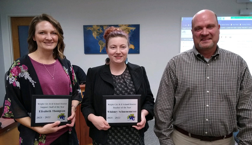 STAFF OF THE YEAR &mdash; Elisabeth Thompson, left, and Whitney Schuenemeyer, center, were named as Wright City R-II&rsquo;s support staff member and teacher of the year. Pictured with them as they receive their awards is Principal Matt Brooks.