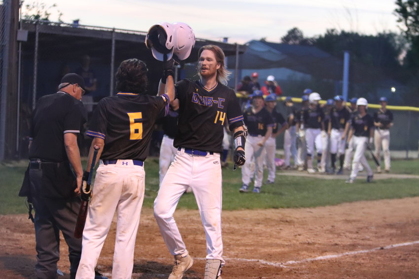 Kyle Johnson (right) celebrates with Nick Moore after Johnson hit a home run in the seventh inning. The Wildcats tied the game before losing on a walkoff home run.