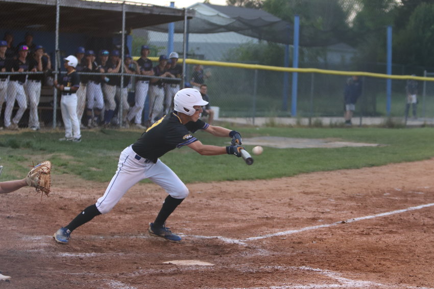 Trey Brakensiek bunts for a hit during last week&rsquo;s district final against St. Charles West.