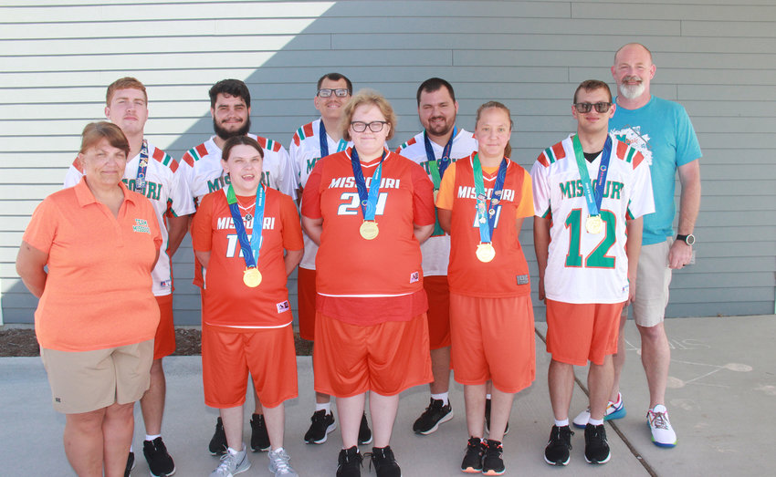 MEDALISTS &mdash; Special Olympics athletes from Warren County display the gold medals they earned at the 2022 USA Games in Orlando, Florida. Pictured in front, from left, are Assistant Coach Julie Busken and athletes Emily Carroll, Brooke Timmerberg, Emily Green and Devin Bock. In back are athletes Jacob Ritter, Dillen Mayfield, Michael Mohrmann, Jonathan Martin, and Coach Rich Black.