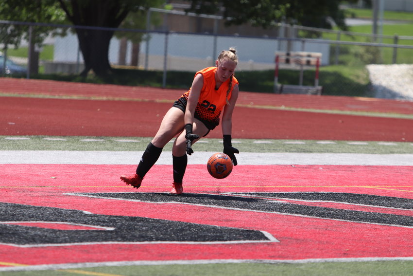 Warrenton goalie Emily Beumel picks up the ball during a game against Hannibal.