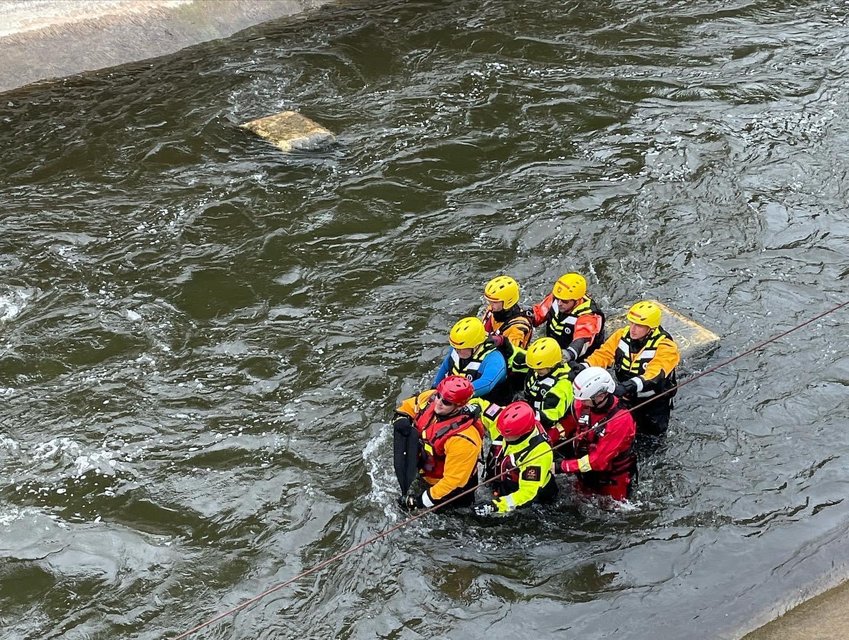 SWIFTWATER TRAINING &mdash; Trainees practice rescue techniques as they navigate the current of the East Race Waterway, part of the Indiana River Rescue School in South Bend, Indiana.