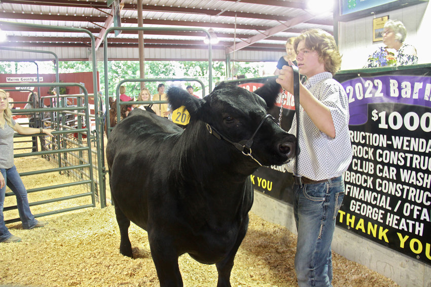 OUTSTANDING AUCTION &mdash; An exhibitor brings a steer up for sale at the July 7 livestock auction at the Warren County Fair. Over $447,000 was brought in by 167 youth exhibitors.