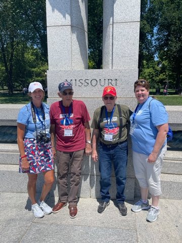 WORLD WAR II MEMORIAL &mdash; Veteran brothers Orville and Vincent Ruether, center, were among the attendees to an honor flight visit to Washington, D.C. They were joined by family members Kim Tarlas, left, and Cheryl Pisane, right.