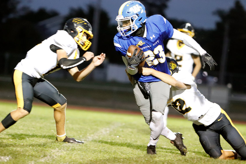 Jeremiah Davis attempts to break a tackle during the first half of Friday&rsquo;s game.