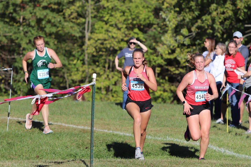 Briana Grooms (left) and Camryn Petersmeyer (right) run down the final stretch of Friday&rsquo;s race.