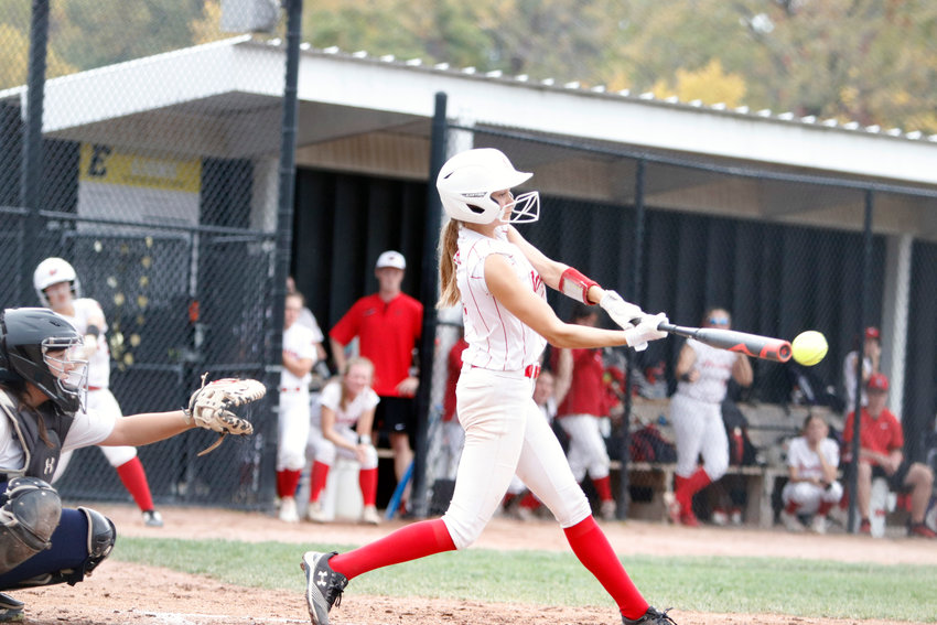 Maddisyn Hoelscher connects on an RBI single during Tuesday&rsquo;s district win over Holt.