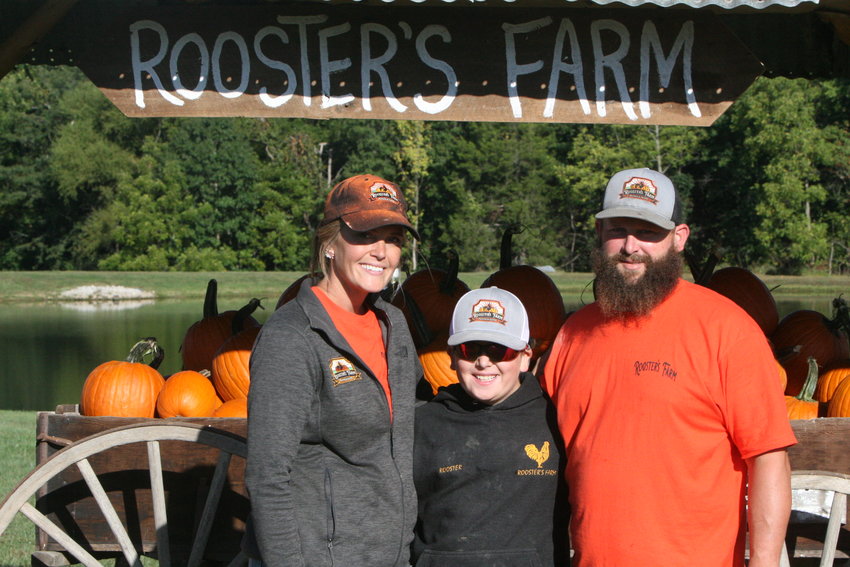 Patty, Brody and Thomas Ludy pose at Rooster&rsquo;s Farm Pumpkin Patch in Jonesburg. The business had its grand opening on Sept. 24.