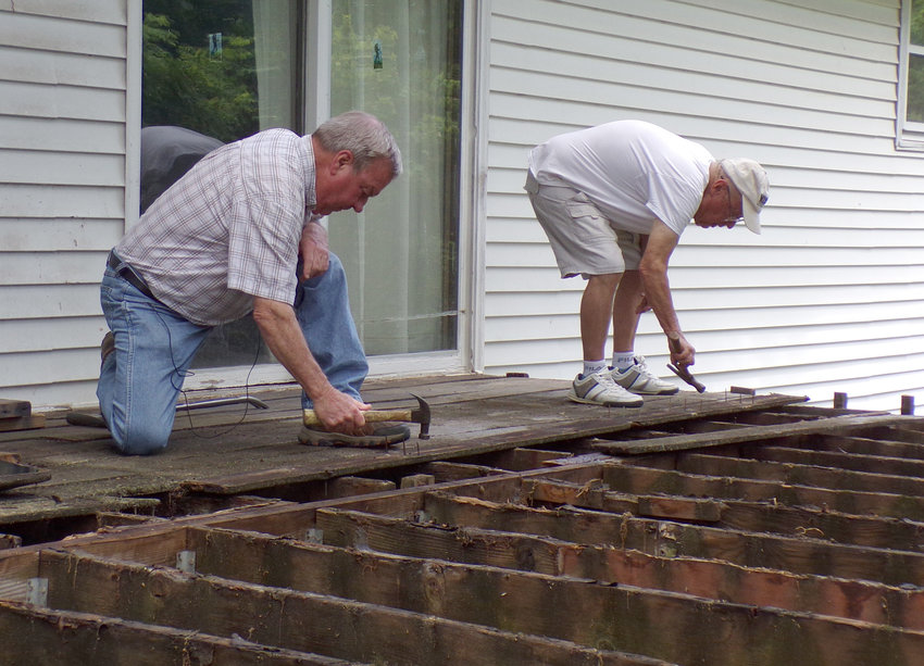 NECAC&rsquo;s Howard Sommer, left, works with Self-Help Housing Program participant Bob Sergent.