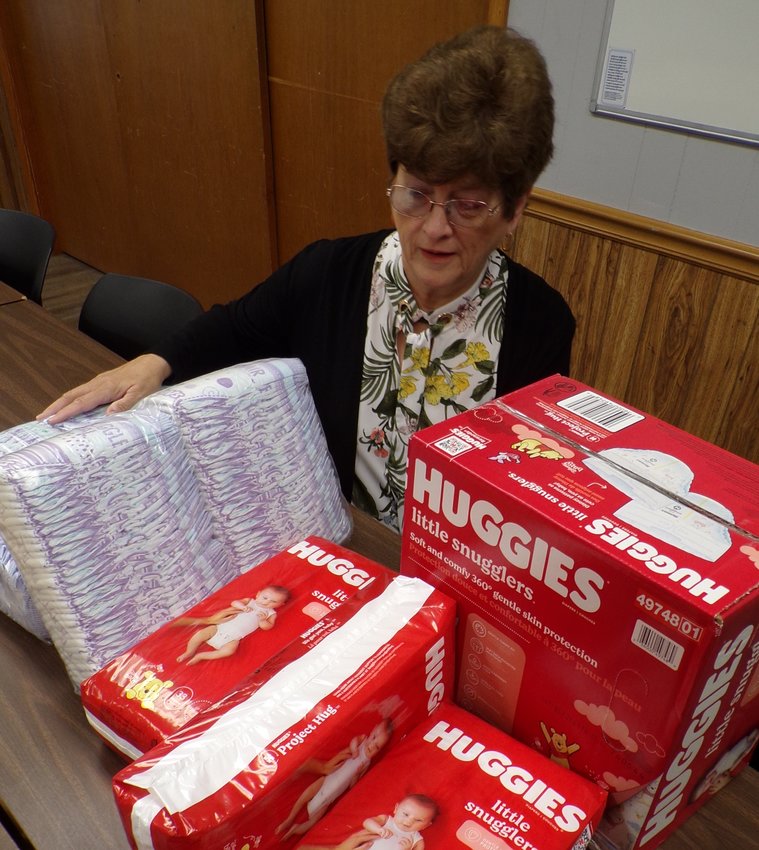 NECAC&rsquo;s Linda Fritz looks over diapers available free to qualifying parents in 12 Missouri counties.