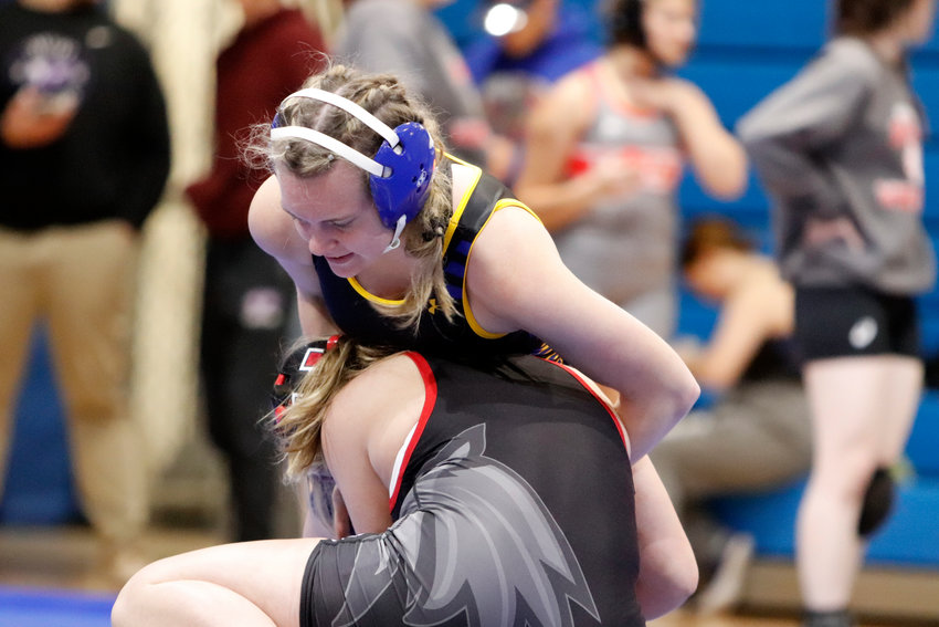 Wright City wrestler Lauren Ritter (top) competes at the Wright City Tournament earlier this season. Ritter was one of six Wright City wrestlers to win their weight class at the John Burroughs Invitational.