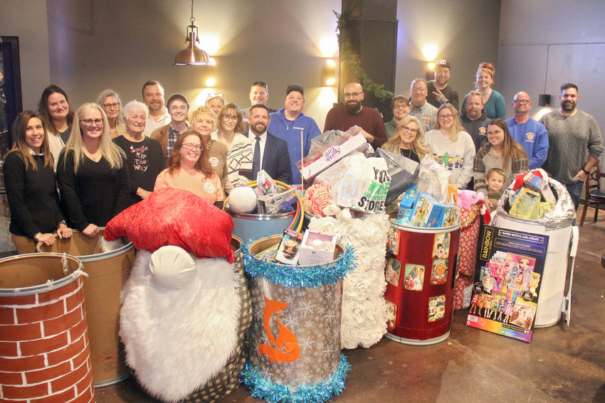 BARRELS OF JOY &mdash; Supporters of the annual Wright City toy drive gathered at the Railhouse Pub with more than 20 barrels of donated toys to celebrate a job well done on Monday, Dec. 5.