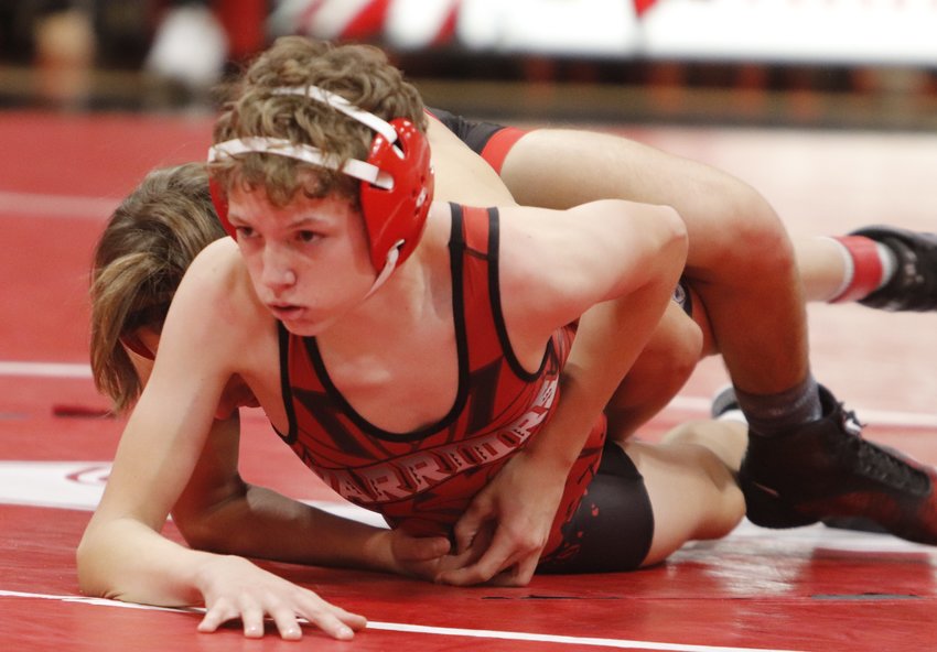 Charles Brake wrestles against Reign Creech of Hannibal during a match earlier this season. Brake won a pair of matches at the Harrisonville Invite last weekend.
