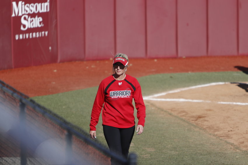 Warrenton assistant softballl coach Katelyn Pettit walks to the first base coach&rsquo;s box during the third place game at the state championship earlier this season. Pettit was recently named the top assistant softball coach in Class 4.
