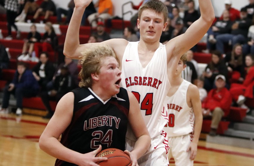 Willie Mueller (left) prepares to go up for a shot during Liberty Christian&rsquo;s loss to Elsberry.