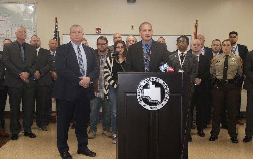 Lt. Scott Schoenfeld with the Warren County Sheriff's Department, center-right, discusses new information about the arrest of a suspect accused of killing a woman in 2004 and dumping part of her remains in Warren County. Schoenfeld presented the information during a Jan. 12 press conference with members of the Greater St. Louis Major Case Squad.