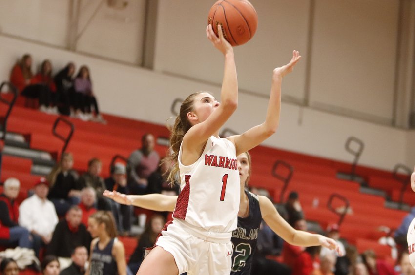 Isabel Benke scores two of her seven points in Friday&rsquo;s loss to Timberland in the Warrenton Tournament championship game.