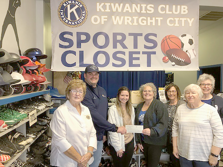Members of the Kiwanis Club of Wright City donate $3,000 to the Wright City Parks Department to purchase baseball equipment. Pictured, from left, are Kiwanis member Mary Groeper, City Sports Director Eric Burton, city sports coordinator Abby Thomas, and Kiwanis members Jennifer Olivio, Michelle Smith, Karen Girondo, and Martha Radginski.